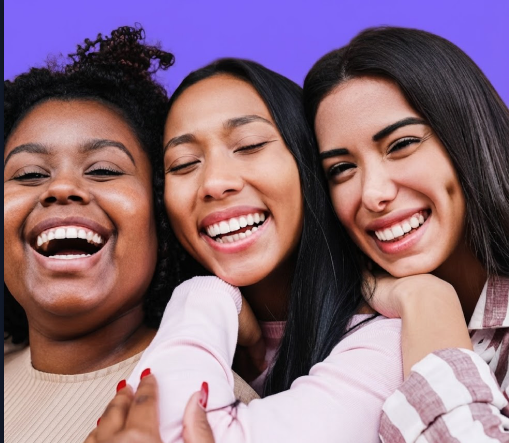 Three girls smiling together